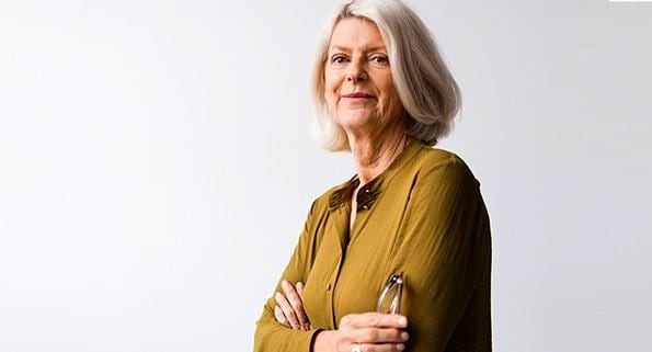 elderly woman with arms crossed
